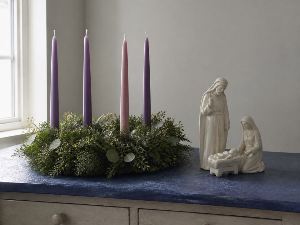 Advent wreath and nativity scene guide: a devotional object arranged on a worktable