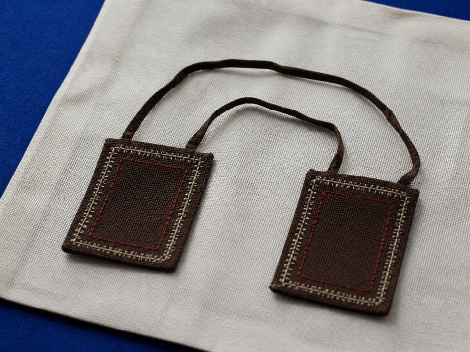 Reading and keeping a fragile devotional textile: a devotional object arranged on a worktable